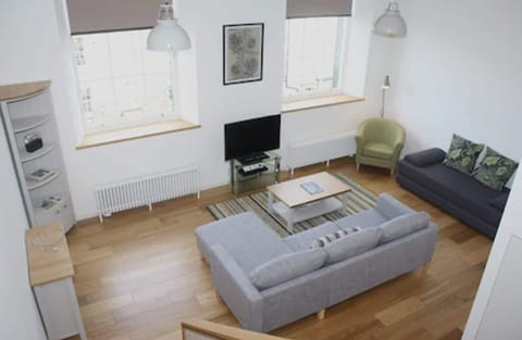 Apartment, 1 Bedroom | Living room | Flat-screen TV