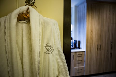 Shower, designer toiletries, hair dryer, bathrobes