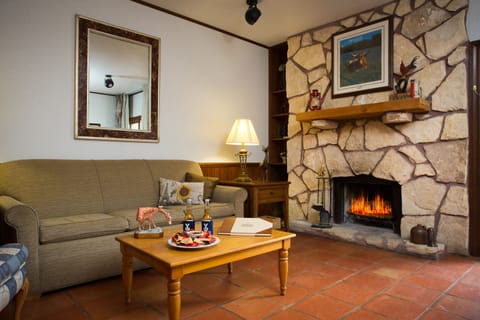 Suite, 1 King Bed | Desk, iron/ironing board, free cribs/infant beds, rollaway beds