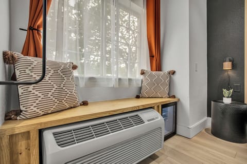 Premium bedding, desk, laptop workspace, blackout drapes