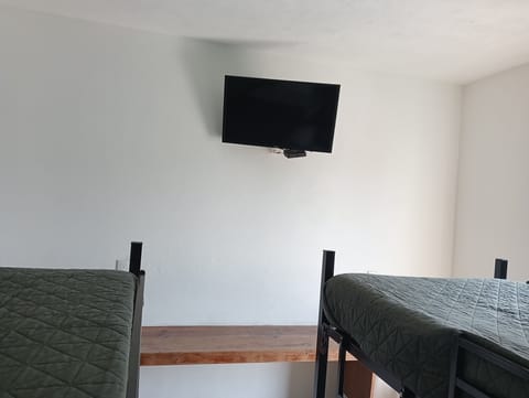 Desk, laptop workspace, blackout drapes, iron/ironing board