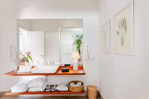 Premier Suite | Bathroom | Designer toiletries, hair dryer, bathrobes, towels