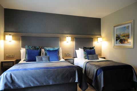 20 bedrooms, premium bedding, pillowtop beds, blackout drapes