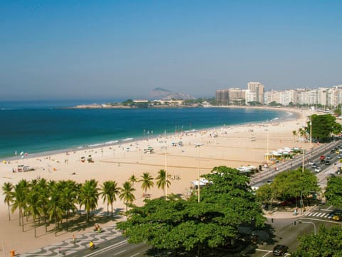 On the beach, white sand, beach umbrellas, beach towels