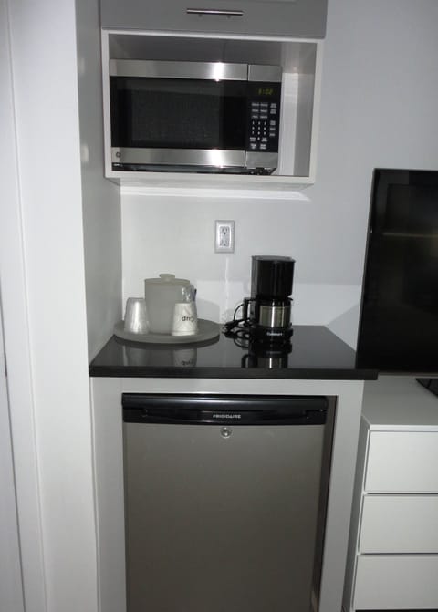 Fridge, microwave, coffee/tea maker, cleaning supplies