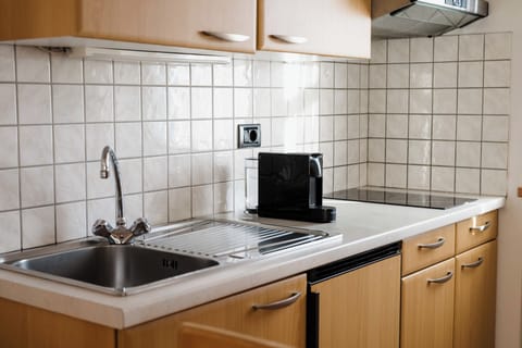 Apartment, Balcony | Private kitchen | Microwave, stovetop, highchair, cookware/dishes/utensils