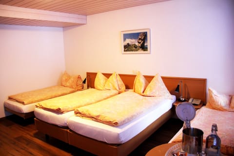 Standard Quadruple Room | In-room safe, desk, free WiFi, bed sheets