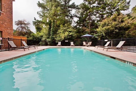 Seasonal outdoor pool, open 8:00 AM to 9:00 PM, sun loungers