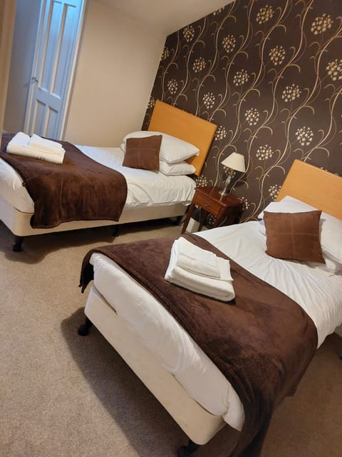 Twin Room (First Floor) | Desk, iron/ironing board, free WiFi, bed sheets