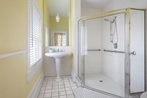 Shower, designer toiletries, hair dryer, bathrobes