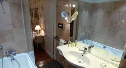 Combined shower/tub, designer toiletries, hair dryer, bathrobes