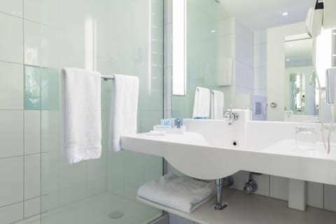 Eco-friendly toiletries, hair dryer, towels