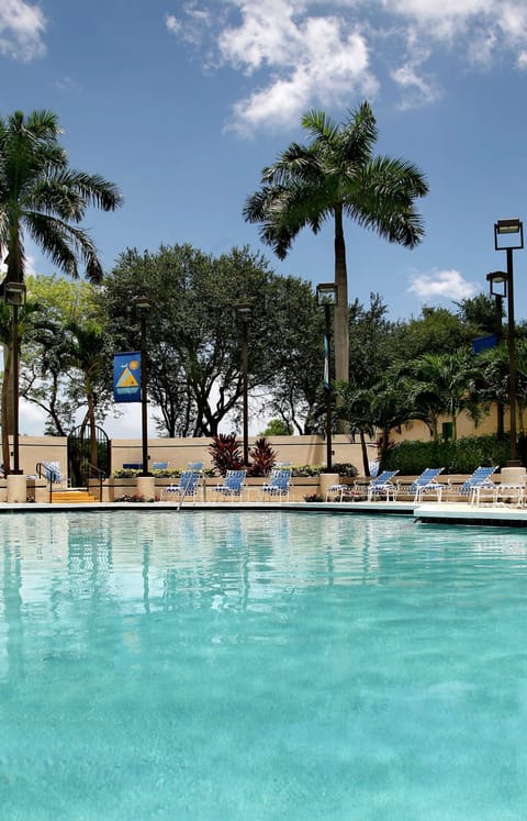 Outdoor pool, pool umbrellas, sun loungers