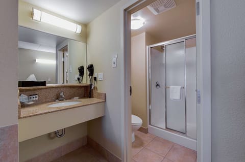 Suite, 1 King Bed, Non Smoking, Jetted Tub | Bathroom | Combined shower/tub, eco-friendly toiletries, hair dryer, towels