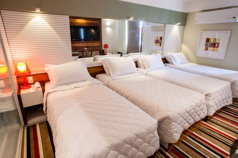 Superior Quadruple Room | Minibar, in-room safe, desk, blackout drapes