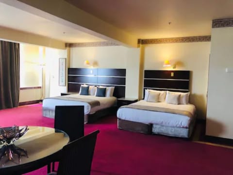 Executive Room | Desk, iron/ironing board, cribs/infant beds, rollaway beds