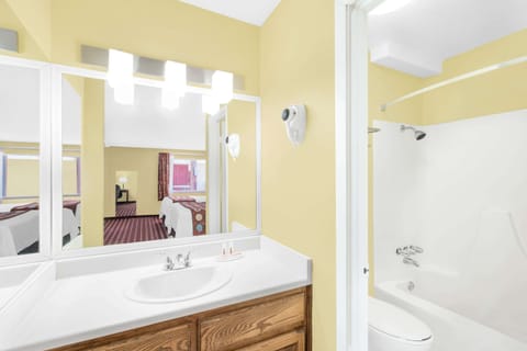 Suite, 2 Queen Beds, Non Smoking | Bathroom | Combined shower/tub, hair dryer, towels