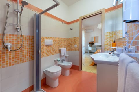 Double Room, Patio (Tulipano) | Bathroom | Shower, rainfall showerhead, free toiletries, hair dryer