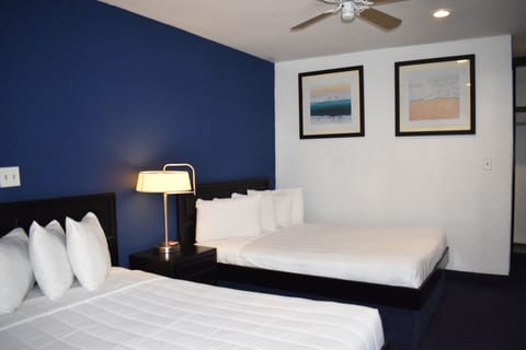 Family Room, 2 Queen Beds | Individually furnished, iron/ironing board, free WiFi