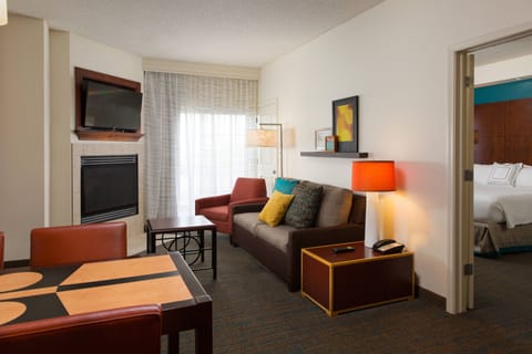 Suite, 2 Bedrooms, Fireplace | Living room | 42-inch TV with cable channels, pay movies