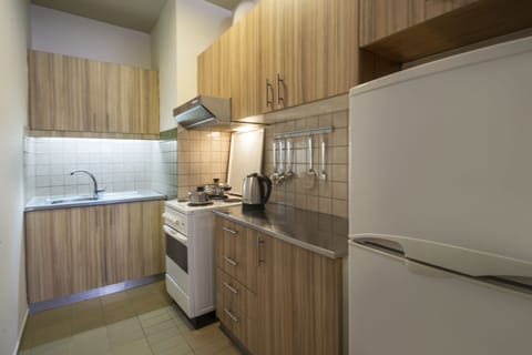 Standard Apartment, 2 Bedrooms, Partial Sea View | Private kitchen | Full-size fridge, oven, stovetop, electric kettle