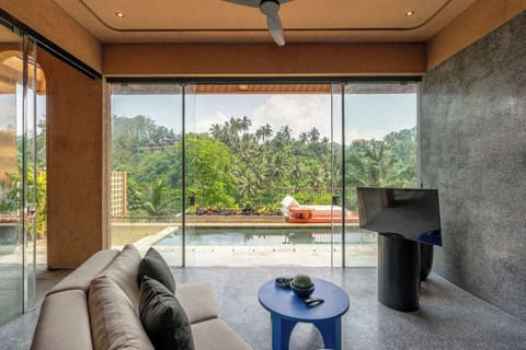 Riverside Pool Villa | Living area | Books