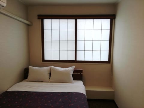 Budget Double Room with Shared Bathroom | Down comforters, blackout drapes, iron/ironing board, free WiFi