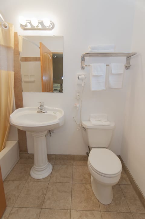 Suite, 1 Queen Bed, Non Smoking | Bathroom | Hair dryer, towels