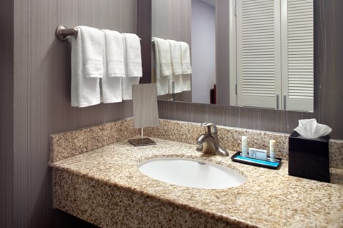 Combined shower/tub, designer toiletries, hair dryer, towels