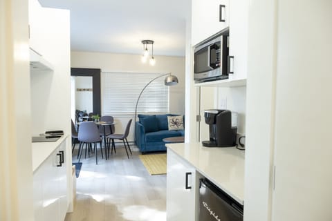 Deluxe Apartment | Private kitchen | Fridge, microwave, coffee/tea maker, electric kettle