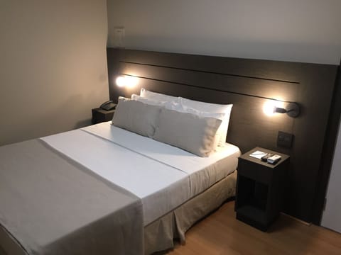 Deluxe Double Room | Minibar, in-room safe, blackout drapes, free WiFi