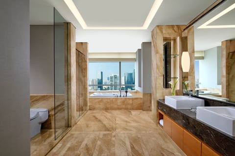 Club Suite, 1 King Bed, City View (Mayfair) | Bathroom | Separate tub and shower, designer toiletries, hair dryer, bathrobes