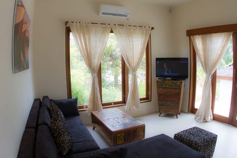 Superior Bungalow, Sea View | Living area | LCD TV