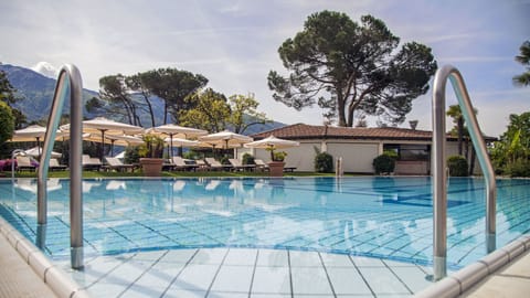 Indoor pool, outdoor pool, open 8:00 AM to 7:00 PM, pool umbrellas