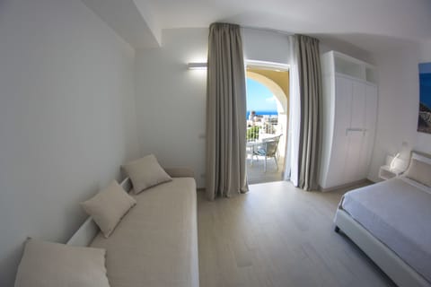 Deluxe Triple Room, Balcony, Sea View | Minibar, in-room safe, desk, free WiFi