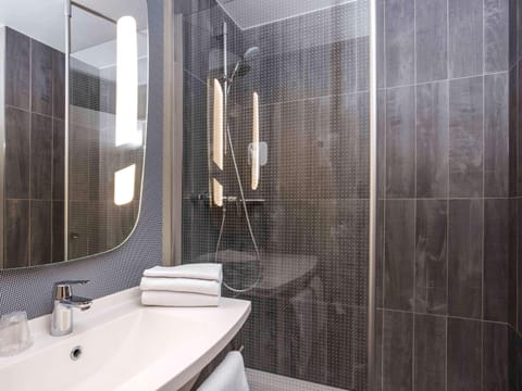 Premium bedding, desk, laptop workspace, iron/ironing board