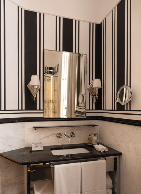 Suite dell' Arancio | Bathroom | Rainfall showerhead, designer toiletries, hair dryer, bathrobes