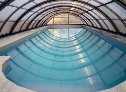 Indoor pool, outdoor pool, pool umbrellas, sun loungers