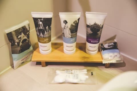 Shower, eco-friendly toiletries, hair dryer, towels