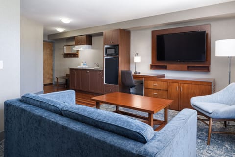 Executive Suite, 1 Bedroom | Living room | 55-inch LED TV with cable channels, TV, pay movies