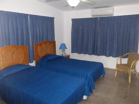 Twin Room | Minibar, iron/ironing board, bed sheets