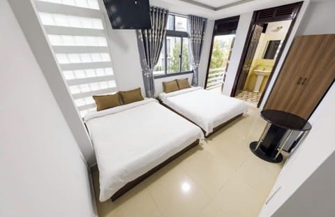 Deluxe Twin Room, Balcony, City View | In-room safe, desk, rollaway beds, free WiFi