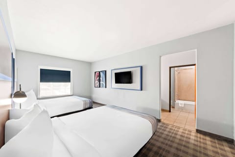 Suite, 2 Queen Beds, Non Smoking | Desk, laptop workspace, blackout drapes, iron/ironing board