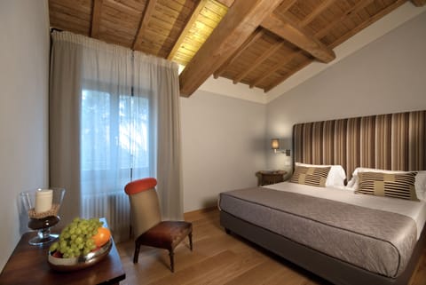 Deluxe Suite, Terrace | Premium bedding, down comforters, in-room safe, iron/ironing board