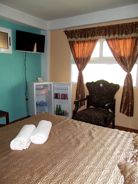 Double or Twin Room | Minibar, in-room safe, iron/ironing board, bed sheets