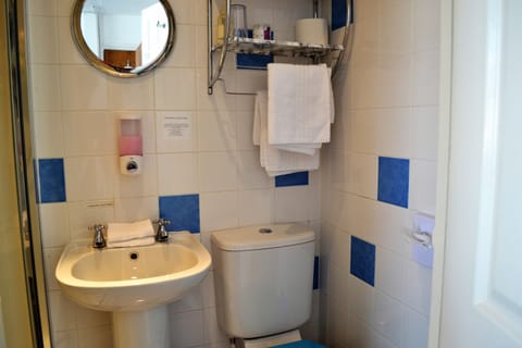 Family Room, Multiple Beds | Bathroom | Shower, free toiletries, hair dryer, towels