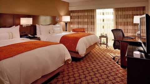 Premium bedding, down comforters, minibar, in-room safe