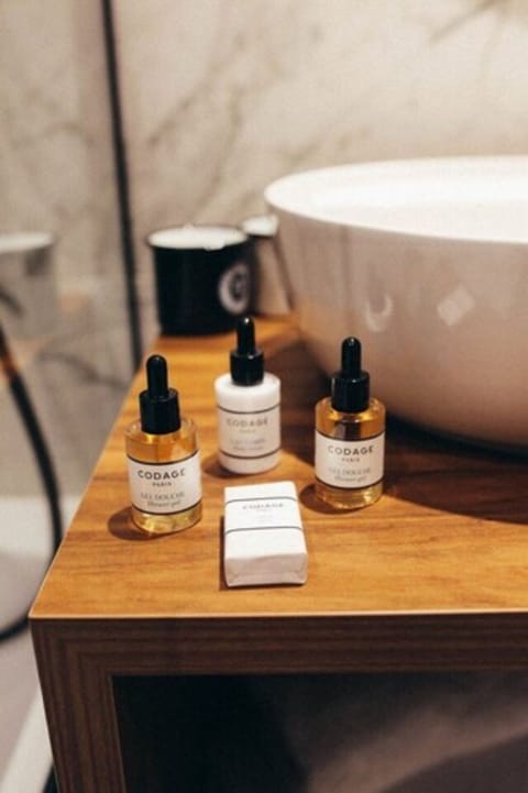 Designer toiletries, hair dryer, bathrobes, slippers