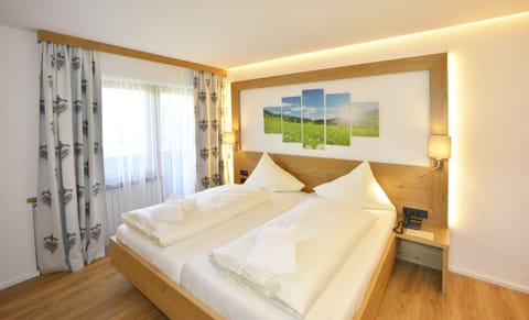 Junior Suite, 1 Bedroom, Garden Area (Seefeld) | Hypo-allergenic bedding, down comforters, in-room safe