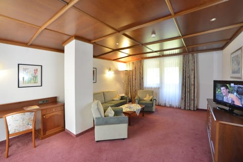 Suite, 3 Bedrooms, 2 Bathrooms (Tirol) | Living area | 55-inch flat-screen TV with digital channels, TV